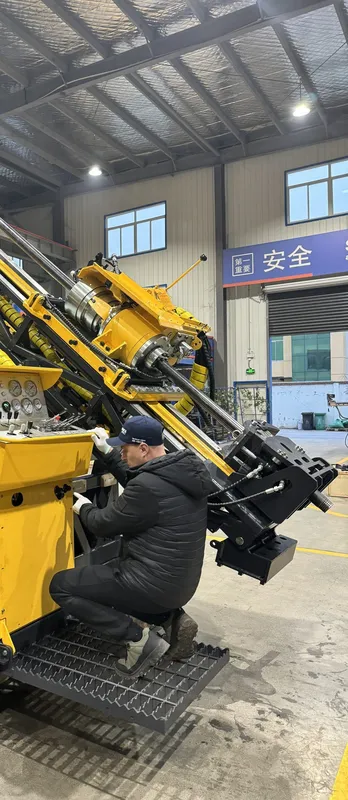 Worker assembling a core drilling rig at the control console in the Jining factory workshop